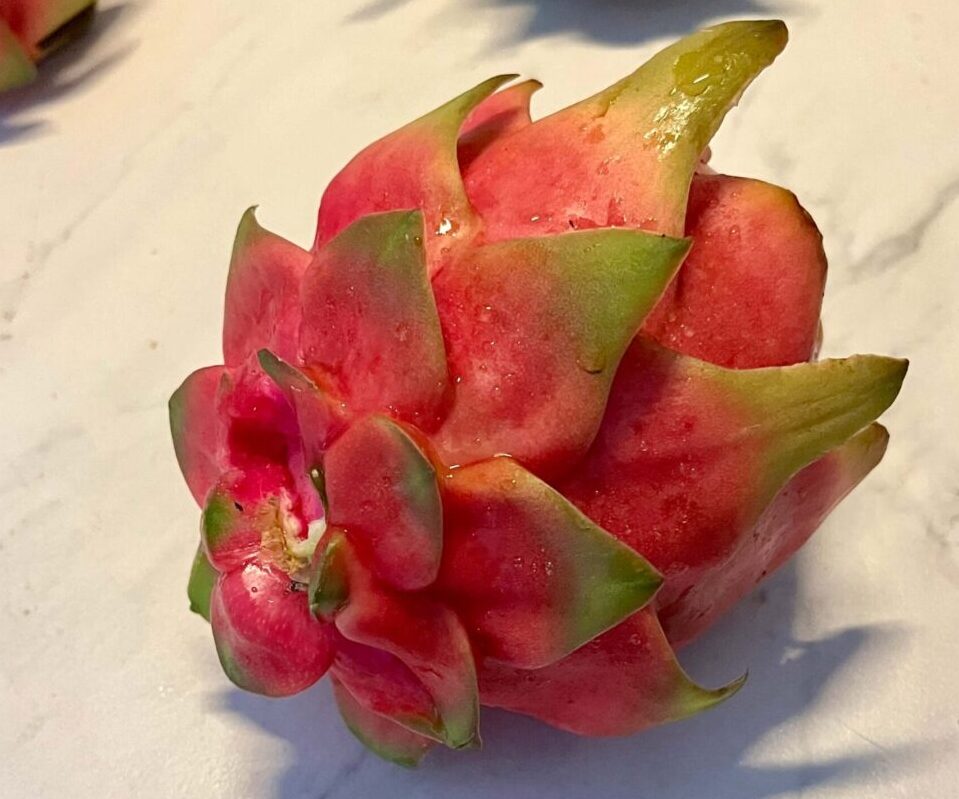 A close up of an open fruit on top of a table.